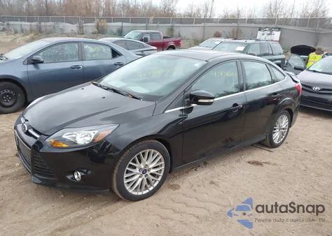 2014 Ford Focus Titanium z USA, uszkodzony, nr VIN 1FADP3J23EL175952